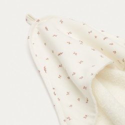 Deya baby towel cape in white cotton with patterns